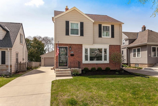 traditional home featuring a detached garage, an outbuilding, a front lawn, and brick siding