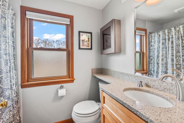 full bath with vanity and toilet