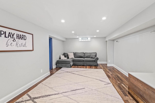 living room with recessed lighting, baseboards, and dark wood-style flooring