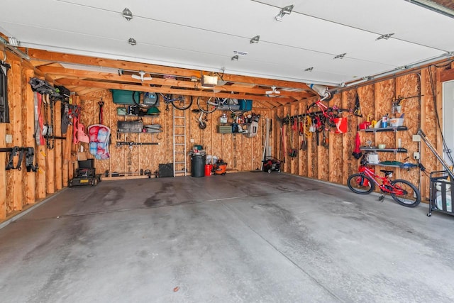 garage with wooden walls and a garage door opener