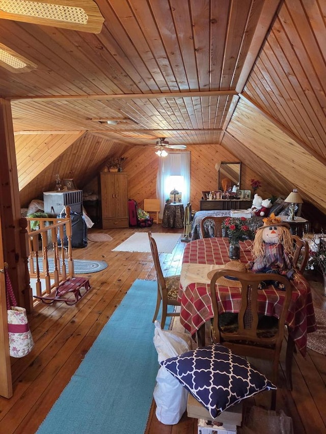 bedroom featuring wood ceiling, vaulted ceiling, wood walls, and hardwood / wood-style floors
