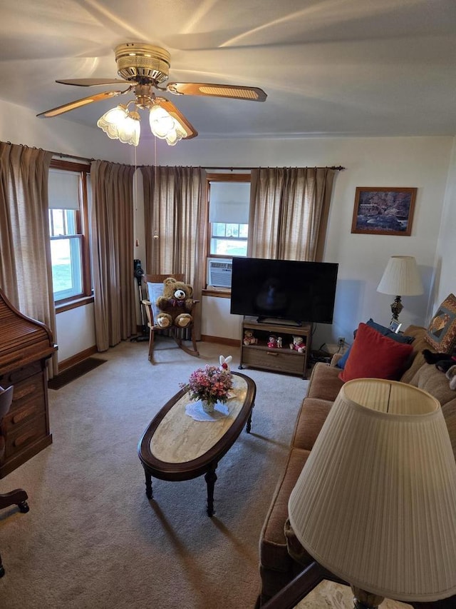 carpeted living area with baseboards, ceiling fan, cooling unit, and a wealth of natural light
