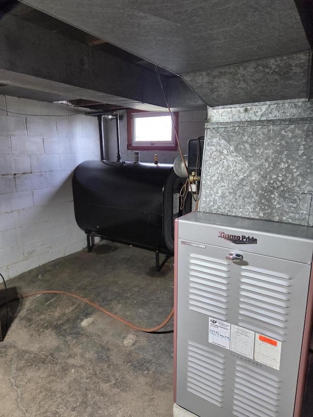 basement featuring heating unit and heating fuel