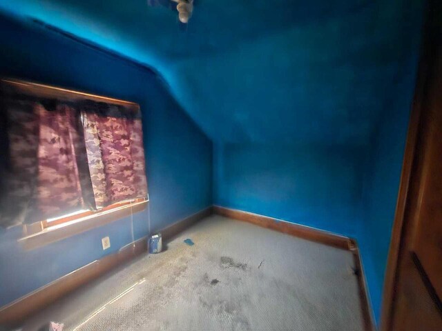 7607 15th Ave, Kenosha, WI 53143 - bonus room with baseboards, carpet, and lofted ceiling