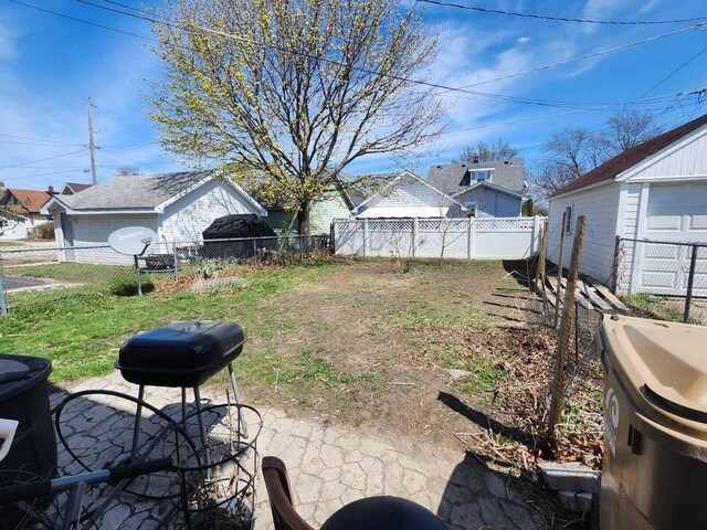 7607 15th Ave, Kenosha, WI 53143 - view of yard featuring a fenced backyard and a patio area