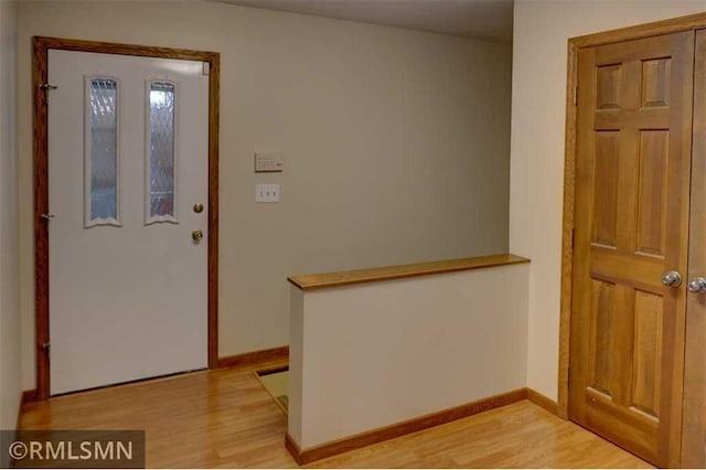 890 Lincoln Ave, Amery, WI 54001 - entryway featuring baseboards and light wood finished floors