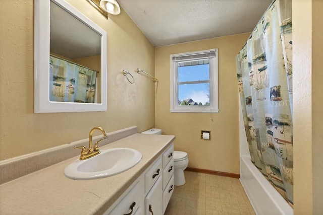 1992 London Rd, Green Bay, WI 54311 - bathroom with vanity, toilet, tile patterned floors, shower / bath combo with shower curtain, and baseboards