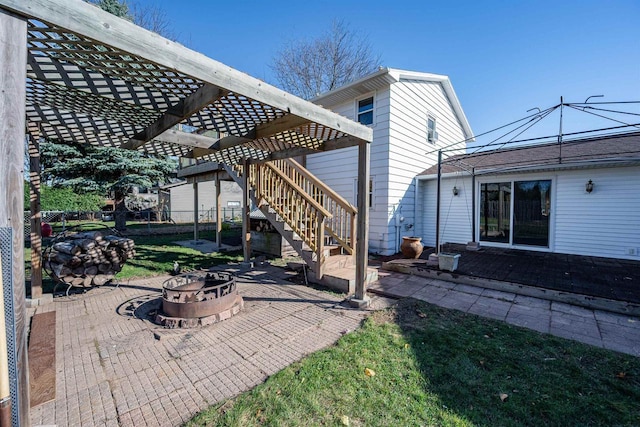 1992 London Rd, Green Bay, WI 54311 - view of patio / terrace with stairs, an outdoor fire pit, and fence