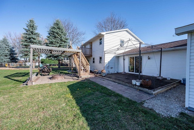 1992 London Rd, Green Bay, WI 54311 - rear view of house featuring fence, stairs, a deck, a patio area, and a yard
