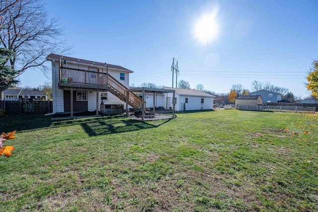 1992 London Rd, Green Bay, WI 54311 - view of yard with stairs, a fenced backyard, a wooden deck, and a pergola