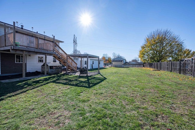 1992 London Rd, Green Bay, WI 54311 - view of yard with stairs, a fenced backyard, a wooden deck, and a shed