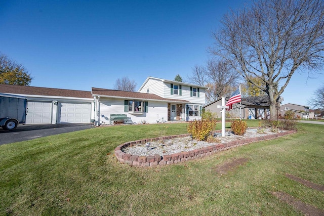 1992 London Rd, Green Bay, WI 54311 - traditional-style house with an attached garage, driveway, and a front lawn