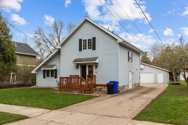traditional home featuring an outdoor structure, a garage, and a front lawn