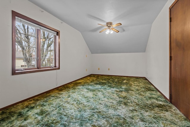 bonus room with carpet floors, a ceiling fan, and vaulted ceiling