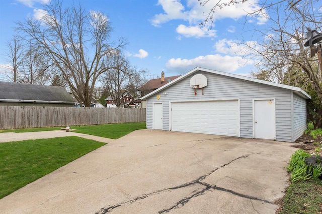 detached garage featuring fence
