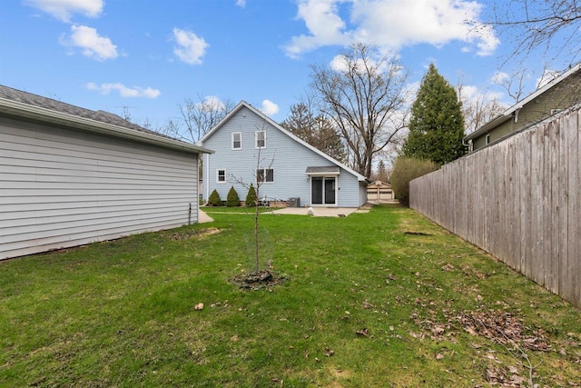 view of yard with fence and a patio