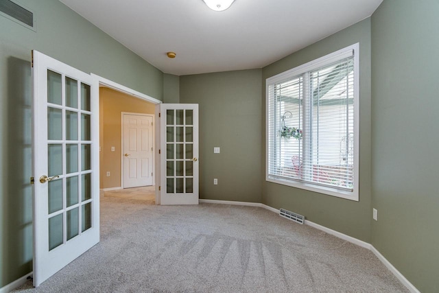 1111 Virgin Lake Dr, Stoughton, WI 53589 - spare room with french doors, carpet floors, and baseboards