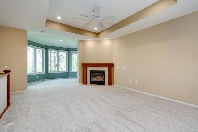 1111 Virgin Lake Dr, Stoughton, WI 53589 - unfurnished living room with recessed lighting, a tiled fireplace, a ceiling fan, carpet flooring, and baseboards
