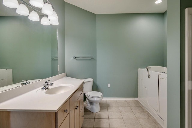 1111 Virgin Lake Dr, Stoughton, WI 53589 - bathroom with tile patterned floors, toilet, vanity, baseboards, and recessed lighting