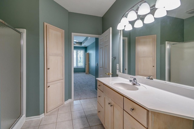 1111 Virgin Lake Dr, Stoughton, WI 53589 - full bath featuring a shower stall, vanity, tile patterned flooring, and baseboards