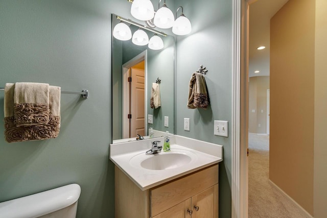 1111 Virgin Lake Dr, Stoughton, WI 53589 - half bath with toilet, vanity, and a chandelier