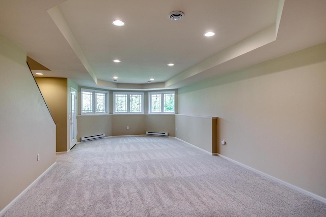 1111 Virgin Lake Dr, Stoughton, WI 53589 - spare room with baseboard heating, light carpet, recessed lighting, baseboards, and a baseboard heating unit