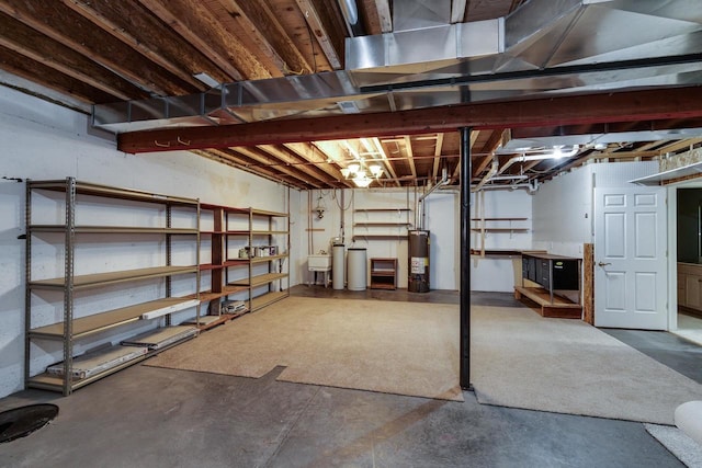1111 Virgin Lake Dr, Stoughton, WI 53589 - unfinished basement with gas water heater and a sink