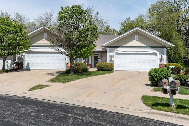 1111 Virgin Lake Dr, Stoughton, WI 53589 - view of front facade with driveway, an attached garage, and brick siding