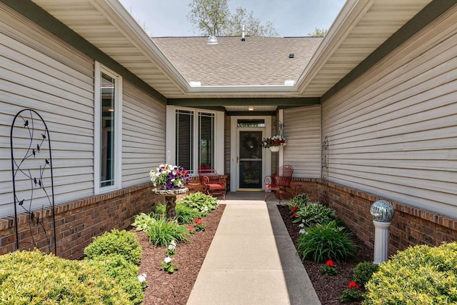1111 Virgin Lake Dr, Stoughton, WI 53589 - doorway to property featuring brick siding and a shingled roof