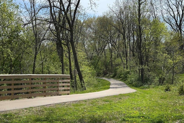1111 Virgin Lake Dr, Stoughton, WI 53589 - view of property's community with fence and a forest view