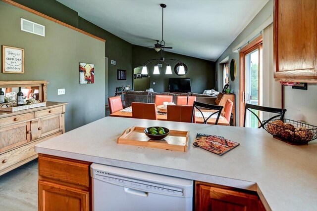 kitchen featuring ceiling fan, a wealth of natural light, lofted ceiling, and dishwasher
