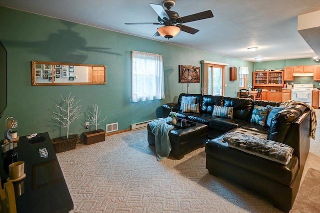living area with light colored carpet, ceiling fan, visible vents, and a baseboard heating unit