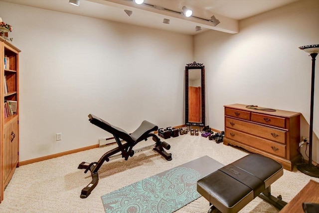 workout area with carpet floors and baseboards