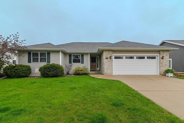 ranch-style home featuring a garage, driveway, a front lawn, and brick siding