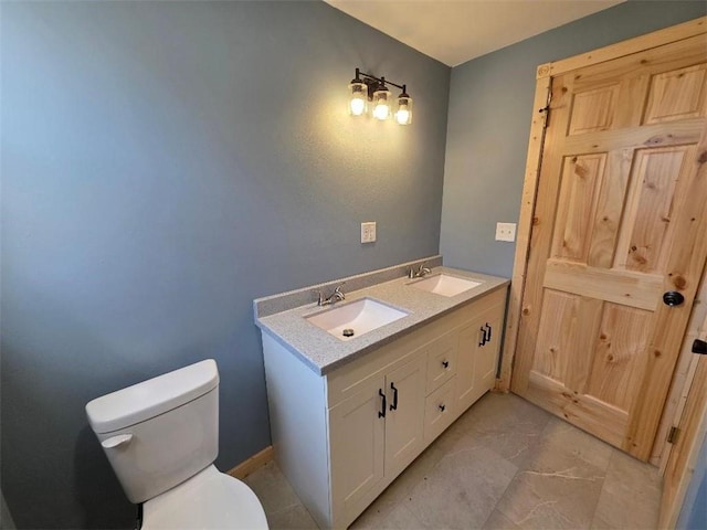 bathroom featuring toilet and a sink