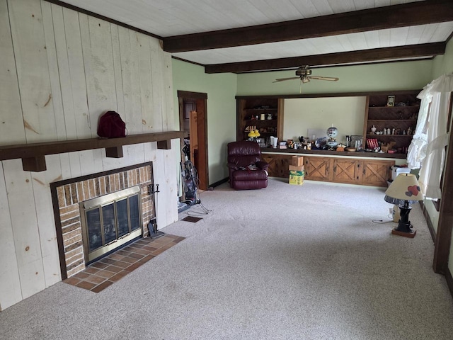 5986 Marsh Rd, Elkhorn, WI 53121 - carpeted living room with wooden walls, beam ceiling, a brick fireplace, a ceiling fan, and wood ceiling