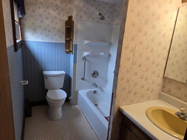 5986 Marsh Rd, Elkhorn, WI 53121 - bathroom featuring tile patterned flooring, shower / bathing tub combination, toilet, and vanity