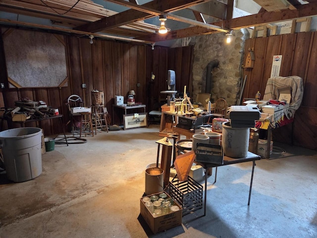 5986 Marsh Rd, Elkhorn, WI 53121 - below grade area featuring a wood stove and wooden walls