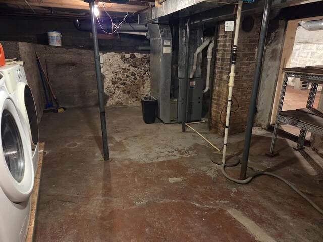 5986 Marsh Rd, Elkhorn, WI 53121 - unfinished below grade area featuring heating unit and separate washer and dryer