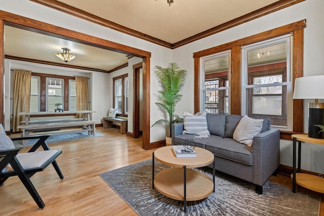 817 E Otjen St, Milwaukee, WI 53207 - living room featuring light wood-style floors, baseboards, and ornamental molding