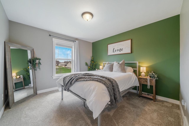 carpeted bedroom with baseboards
