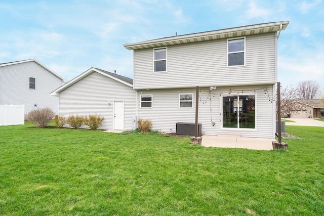 back of property with a yard, a patio, and central air condition unit