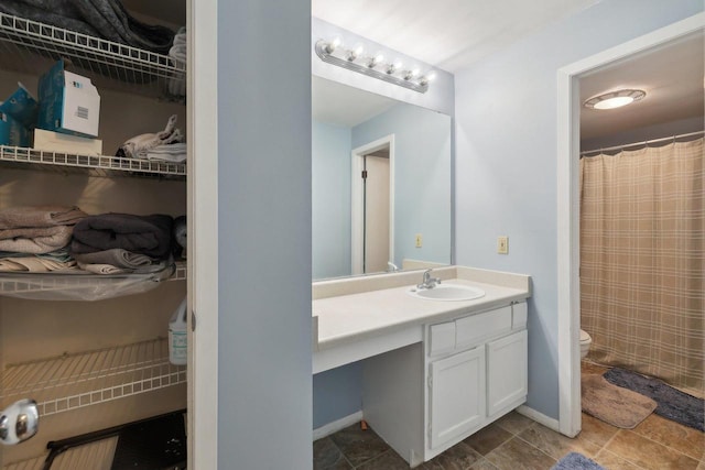 full bathroom with vanity, a shower with curtain, and toilet