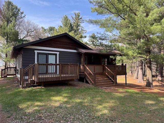 12014 102nd, Chippewa Falls, WI 54729 - rustic home featuring stairs, a deck, and a front yard