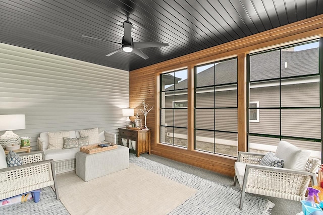 interior space featuring a ceiling fan and a wealth of natural light
