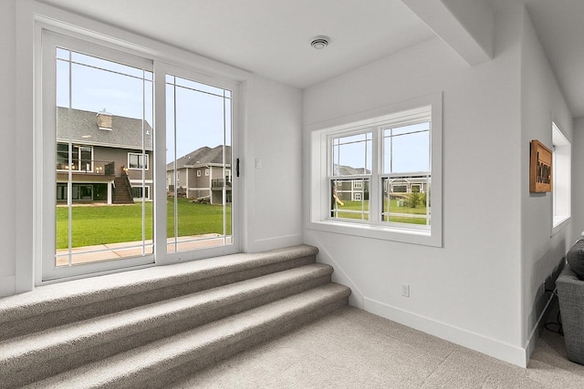 interior space featuring baseboards