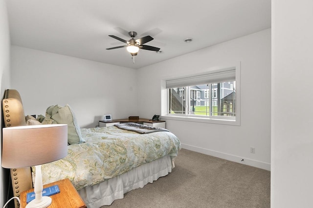 bedroom featuring baseboards, carpet, and ceiling fan