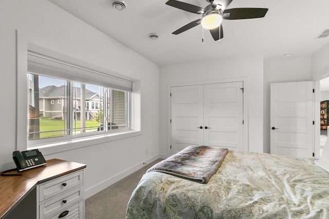 carpeted bedroom featuring baseboards, visible vents, ceiling fan, and a closet
