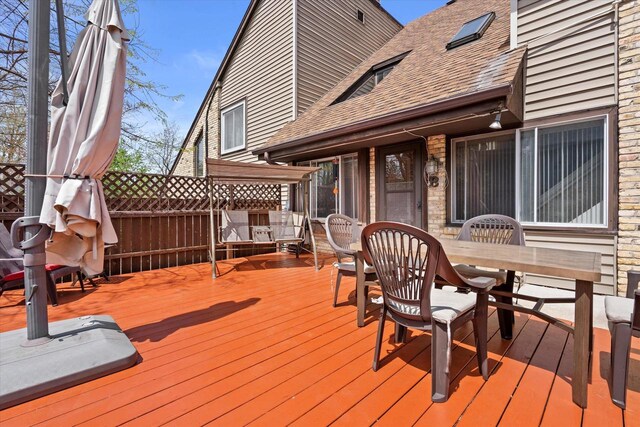 deck with outdoor dining area