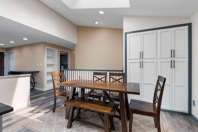 dining room with recessed lighting, baseboards, and light wood-type flooring